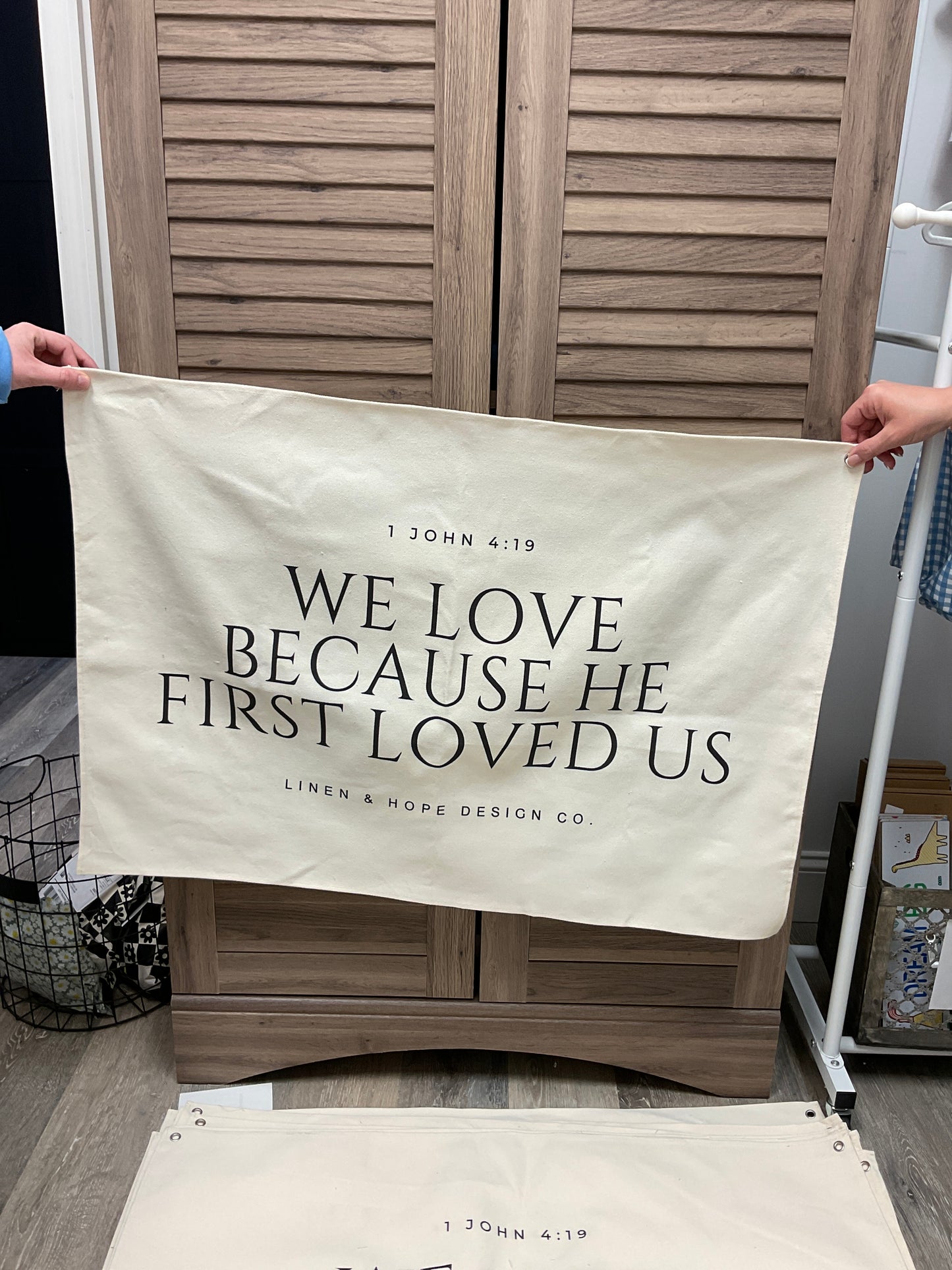 Because He first loved us banner